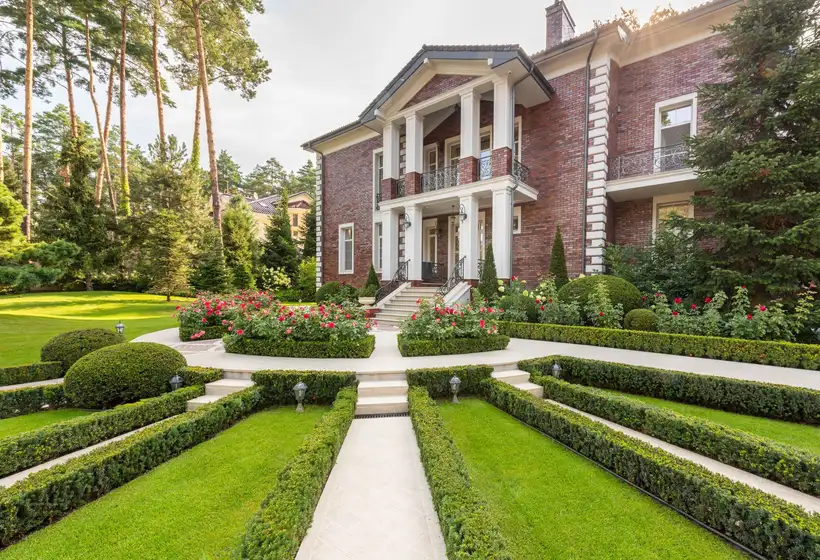 Formal landscaped garden with hedges and flower beds